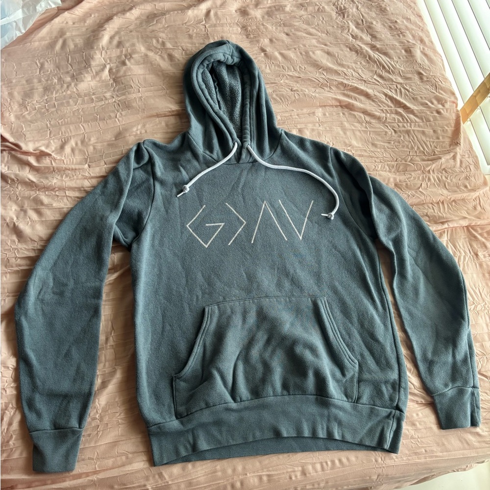 Blue GOD IS GREATER THAN HIGHS AND LOWS hoodie.
